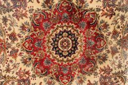 A Kashmir fringed rug with medallion centre on cream ground, 122 cm  x 244 cm.   CONDITION