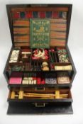 A Victorian coromandel brass mounted games compendium, with fitted interior containing ivory and