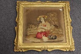 A pair of needlework pictures depicting children with animals, 40 cm x 37 cm, both parts framed. (2)