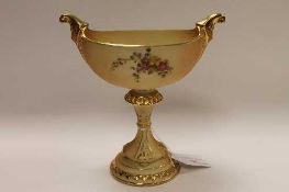 A Royal Worcester blush ivory gilded comport, shape 280, height 19.5 cm.    CONDITION REPORT: