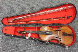 A violin with two bows, cased.   CONDITION REPORT:  A Stradivarious copy, early twentieth century,