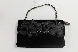 A Chanel black leather and velvet hand bag, with authenticity card no. 10172611.   CONDITION REPORT: