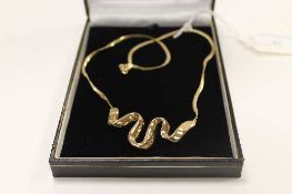 A 14ct gold swirl pendant on flat link necklace, 5.6g.   CONDITION REPORT:  Good condition.