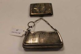A silver purse, Birmingham 1942, together with a silver cigarette case. (2)   CONDITION REPORT:  The