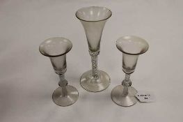 A pair of early nineteenth century wine glasses, with cotton twist stems, height 17 cm, together