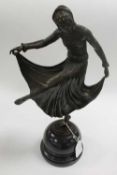 A bronze study of an Art Deco style dancer, on marble socle, height 46 cm.   CONDITION REPORT:  Good