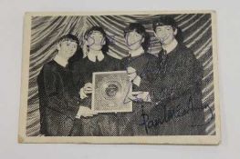 A first series A & B C Beatles Bubble Gum card no. 60, signed by John Lennon.   CONDITION REPORT: