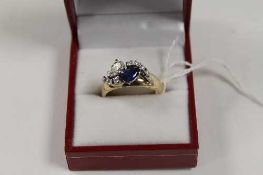 An antique sapphire and diamond ring.   CONDITION REPORT:  Later mounting on antique yellow metal
