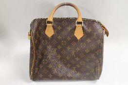 A Louis Vuitton hand bag, with retail pouch and box.   CONDITION REPORT:  Good condition.