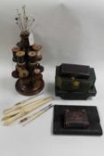 A late Victorian mahogany bobbin stand, together with vintage glove stretchers and sewing sets