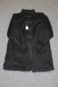 A Mcdonald and Simpson black mohair lady's coat.   CONDITION REPORT:  Good condition.