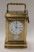 A French brass carriage clock, by Sainte-Suzanne, height 14.5 cm.   CONDITION REPORT:  Good