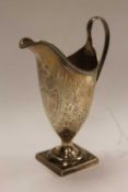 An early nineteenth century silver cream jug, London 1828, Stephen Adams II.   CONDITION REPORT: