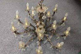 An early twentieth century ten branch metal and glass chandelier, with twenty lights and crystal