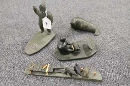An interesting collection of four Inuit stone carvings, comprising of Walrus, Standing Eskimo,