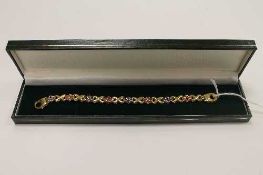 A 9ct three tone gold bracelet, 14.3g.   CONDITION REPORT:  Good condition.