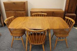 A light elm Ercol seven piece dining room suite, comprising of sideboard, width 129 cm, drop end