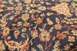 A Kashmir sharbass design fringed carpet on blue ground 240 cm x 330 cm.    CONDITION REPORT: