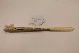 An early twentieth century ivory stanhope letter opener, depicting a bird's eye view of elite