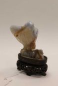 A Chinese jade figure depicting tengu, on stand, height 7.5 cm.   CONDITION REPORT:  Unusual
