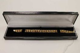 A 14ct textured three tone gold bracelet, 11g.   CONDITION REPORT:  Good condition.
