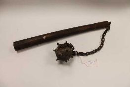 An antique iron spiked ball mace on chain with wooden shaft.   CONDITION REPORT:  Good time aged