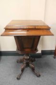 A Victorian rosewood sewing table, on pedestal base, width 50 cm.   CONDITION REPORT:  Good