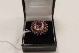 A 9ct gold amethyst and diamond cluster ring, 7.4g.   CONDITION REPORT:  Good condition.