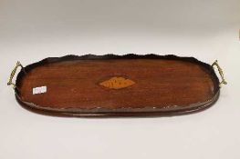 An Edwardian inlaid mahogany oblong tray, with gilt brass handles, width 58 cm.   CONDITION REPORT: