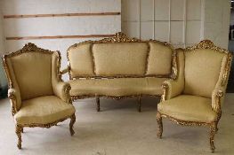 A nineteenth century gilt wood three piece lounge suite, comprising of pair of armchairs and three