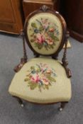 A Victorian walnut nursing chair with tapestry seat.   CONDITION REPORT:  Good condition.