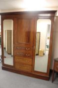 A late Victorian inlaid mahogany compactum wardrobe, width 188 cm, together with the matching