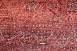 An Afghan Kahn Mahamadi fringed wool rug, 254 cm x 178 cm.   CONDITION REPORT:  Good condition.