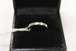 A platinum diamond half eternity ring.   CONDITION REPORT:  Good condition.