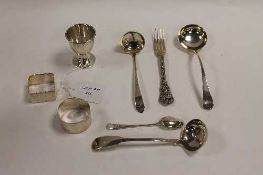 A silver egg cup, together with two silver napkin rings and five items of cutlery. (8)   CONDITION