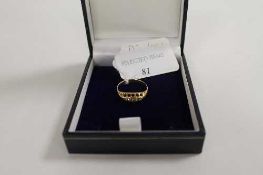 An 18ct gold five stone diamond ring. CONDITION REPORT: Good condition.