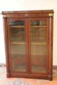 An Empire style mahogany bookcase, width 110 cm. CONDITION REPORT: Good condition.