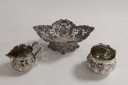 A silver bon-bon dish with pierced decoration, Sheffield 1898, together with a silver cream jug