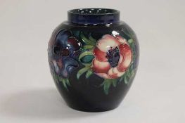 A Moorcroft vase decorated with  amaryllis, height 13 cm. CONDITION REPORT: Good condition,
