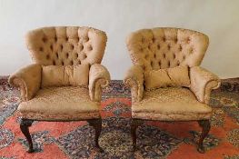 A pair of early twentieth century walnut armchairs. (2) CONDITION REPORT: Good condition, lower legs