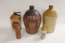 A collection of twenty-nine stoneware flagons and advertising stoneware. (29) CONDITION REPORT: Some