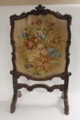 A Victorian carved oak tapestry fire screen, height 100 cm. CONDITION REPORT: Good condition.