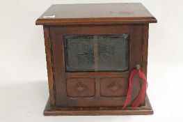 An Edwardian mahogany smoker's cabinet, width 39 cm. CONDITION REPORT: Fair condition, some time