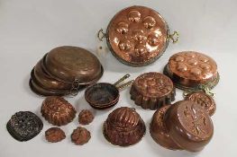 Nineteen nineteenth and later century copper kitchen items including jelly moulds, lids, pans,