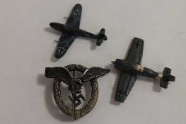 A period Third Reich pilot's badge, the reverse stamped Junker Berlin, together with two crafted