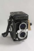 A Yashica-635 35mm camera. CONDITION REPORT: Lens 664319 f 80mm, 661390 f=80mm, condition good.