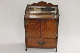 A late Victorian oak smoker's cabinet, width 30.5 cm. CONDITION REPORT: Good condition.