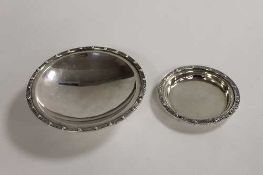 A silver dish on raised foot, Birmingham 1965, together with a small silver dish of the same