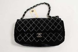 A Chanel black velvet shoulder bag, with authenticity guarantee card no. 9556603. CONDITION