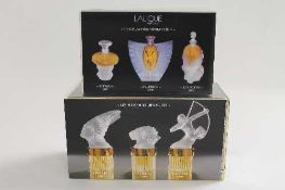Two sets of Lalique perfume bottles,  'Les Mascottes Miniatures', and 'Les Introuvables', both parts